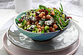 Salad with chickpeas, celery, arugula, and blue cheese