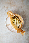 Baked asparagus with olive oil cooked in parchment paper