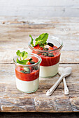 Cream pudding with strawberry puree and pumpkin seeds