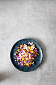 Purple cauliflower salad with carrots, fennel, and mustard dressing