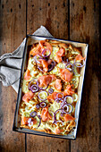 Tarte flambée with salmon, quince and braised cucumber