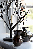 Ornamental tree and pottery jugs on Rye windowsill, Sussex