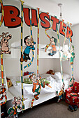 Bunk beds in children's bedroom with characters from the Beano magazine