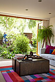 Seating area in living room of houseboat in Richmond upon Thames, England, UK