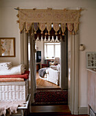 View through open door into room with day bed