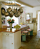 Bench seat at breakfast table in country style kitchen