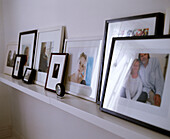 Family photographs arranged on shelf