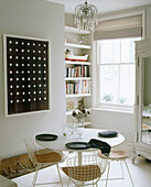 White round dining table with wire work chairs