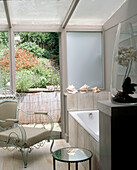 Bathroom with an open door leading to a patio area