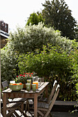 Wooden table and chairs on roof garden