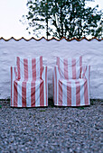 Red striped covered chairs on gavel area
