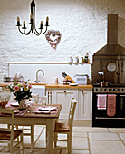 Country style kitchen with dining area with table and chairs
