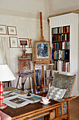 Easel desk and book case in 17th century Hampshire home, England, UK