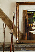 Original 17th century timber beams with picture frame and pool cues in Hampshire home, UK