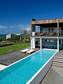 Holiday home exterior with swimming pool and balcony terrace