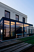 Glass paned porchway of modern building exterior