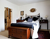 Brass single bed with storage unit in 1820s house