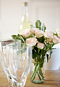 Pink roses and glassware