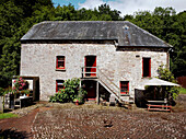 Stone exterior and cobblestone courtyard of barn conversion 