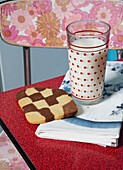 Milk and cookie on table of 1950s style kitchen