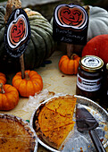 Pumpkin pies and chutney on table at summer fete