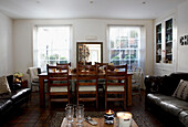 Dining table and chairs with sofas in Grade II listed Georgian townhouse in London