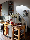 Kitchen with staircase in Grade II listed Georgian townhouse in London