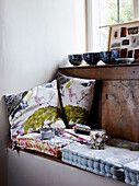 Handmade fabric cushions on Devon cottage window seat