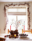 Natural Christmas decorations in dining room of country home