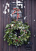 Christmas wreath hanging on front door