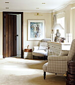 Matching chairs in living room of Forest Row farmhouse Surrey England UK