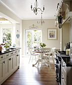 Sunlit open plan Gateshead kitchen with double doors opening to garden Tyne and Wear England UK