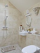 Bathroom detail wet room with shower fitting in Hexham country house Northumberland England UK