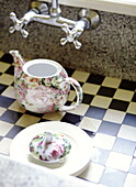 Floral teapot in checked patterned sink Abbekerk Dutch province of North Holland in the municipality of Medemblik