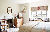 Floral blinds at window in girls bedroom in Oxfordshire farmhouse, England, UK
