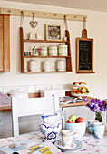 Wall mounted shelf unit in kitchen of Oxfordshire cottage, England, UK