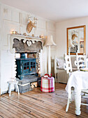 Woodburning stove in living room of Derbyshire farmhouse England UK