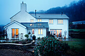 White painted house in rural Devon countryside UK