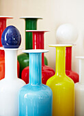 Colourful vintage vase collection in London townhouse England UK