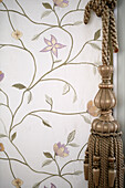 Floral patterned embroidery and tassle in traditional country house Welsh borders UK
