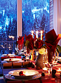 Lit candles on Christmas dinning table in St Anton, Tyrol, Austria