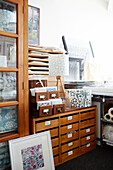 Drapers cabinet with stock in textile designers' Birmingham work studio England UK