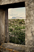 View through window of derelict coastal cottage in County Sligo Connacht Eire