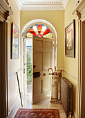 Fanlight above front door with umbrella stand in Georgian home in Talgarth, Mid Wales, UK