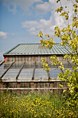 Glass and metal roofs on building exterior in Powys countryside, Wales, UK