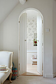 View through double doors to ensuite bathroom from Oxfordshire bedroom, UK