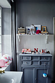 Christmas ornaments and grey cupboards in Brittany cottage, France