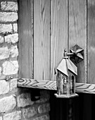 Metal lantern mounted on exterior of Cotswolds home, UK