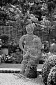 Wire mesh sculpture in Cotswolds garden, UK