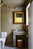 Gilt framed mirror above washbasin with neon sign 'perfect' in Sligo home, Ireland